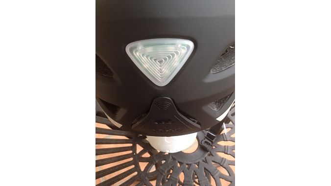 The rear of Abus’ Pedelec helmet features a light with three setting plus a compartment for a helmet “rain cape.”