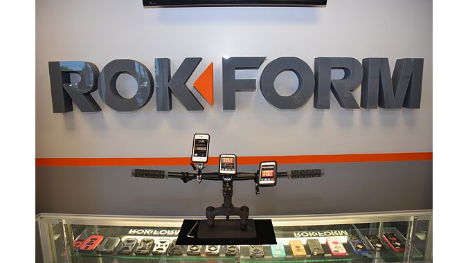 A point-of-purchase display demonstrates handlebar mounting options for Rokform’s phone cases.