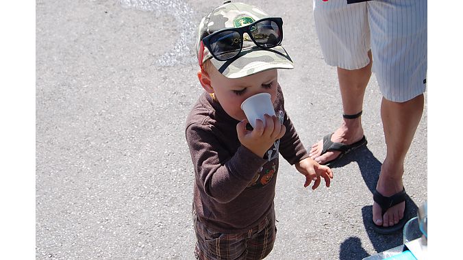 Start 'em early. A tot hydrates with an Osmo Nutrition drink Monday at Outdoor Demo. Photo: Nicole Formosa