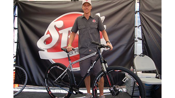 Spot's Andrew Lumpkin shows the new Honey Badger steel 29er with Gates' Carbon Drive belt system. Spot returned to Outdoor Demo after a six-year absence with a demo fleet of about 14 Badgers. Spot ponied up $6,000 to fly the bikes from its Asian factory to make sure they made it across the Pacific in time for this week's show. Photo: Nicole Formosa