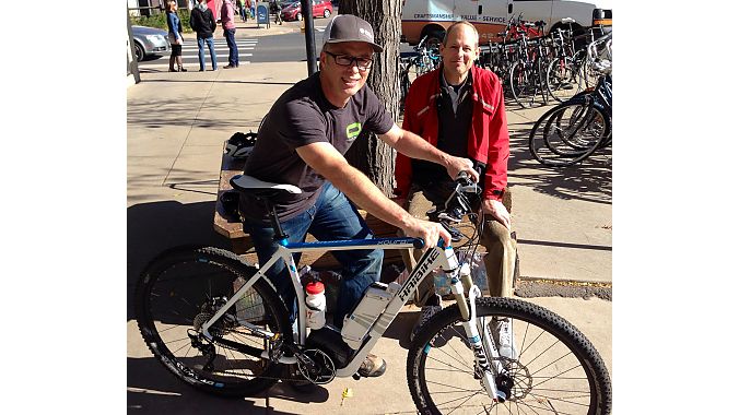 University Bikes GM Lester Binegar and Boulder Valley School District Bicycle Coordinator Landon Hilliard give it a spin.