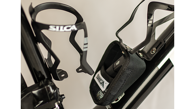 The Sicuro Capsule is a magnetically closing storage cage that bolts to the accessory ports on Sicuro carbon cages.