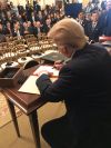 White House photo of Trump signing the agreement Wednesday.